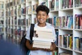 Elementary school boy holding books